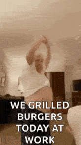 a man is dancing in a room with the words `` we grilled burgers today at work '' written above him .