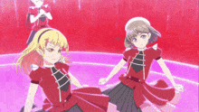 two anime girls in red dresses are dancing on a purple stage