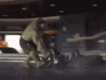 a man in a hulk costume is kneeling down on the ground