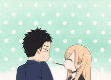 a man and a woman are standing next to each other and the woman is eating a poke stick