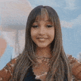 a close up of a woman 's face with long hair and a necklace .