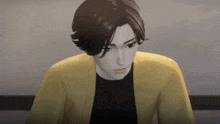 a man in a yellow cardigan and black shirt