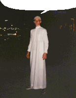 a man in a white robe is standing in front of a building that says ' dubai mall ' on it