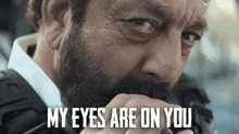a close up of a man 's face with the words my eyes are on you