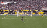 a soccer game is being played in front of a crowd and the score is 1-1