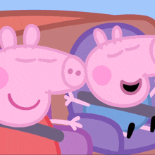 two peppa pigs are sitting next to each other