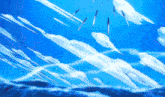 a bunch of knives are flying through the air in a blue sky