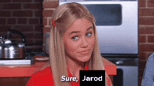 a woman in a red shirt says sure jarod