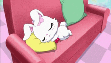 a cartoon rabbit is sleeping on a pink couch .