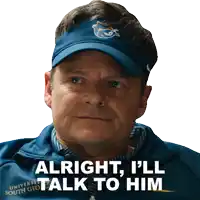 a man wearing a blue hat says alright i ll talk to him