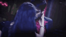 a man and a woman are dancing in a crowded room