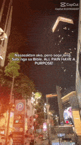 a picture of a city street at night with a caption that says nasaaktan ako pero sege lang sabi nga sa bible