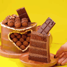 a slice of chocolate cake on a wooden plate with a chocolate bar on top