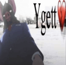 a man in a bat mask is standing in front of a sign that says ygett