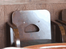 a chair with a hole in the back of it that looks like a face