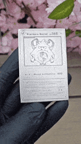 a person is holding a silver card that says stackers social