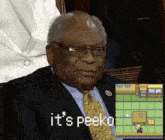 a man in a suit and tie with the words it 's peeko next to him