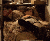 a woman laying on a bed reading a book with a leopard print comforter