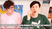 two men are sitting next to each other with a quote from phil lester