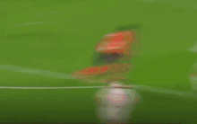 soccer players on a field with a sign that says lotto