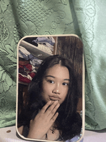 a girl is taking a selfie in a mirror