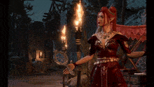 a woman with red hair is holding a torch