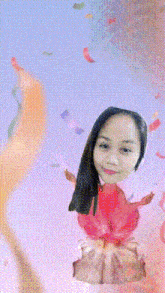a girl with a birthday hat on her head is surrounded by confetti