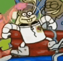 a cartoon character named sandy cheeks is sitting on a couch