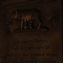 a plaque that says romulus and remus twin brothers born to the god of war a vestal virgin whose unbreakable bond was