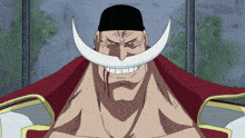a man with a white mustache and a black hat is smiling