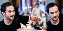 a man with a ring on his finger talks to another man at a table