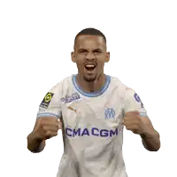a soccer player wearing a ma cgm jersey celebrates with his fist in the air