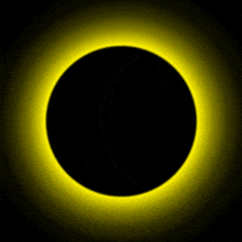 a black circle is surrounded by a yellow light
