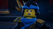 a ninjago character with a blue scarf around her neck