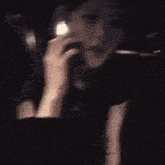 a woman is sitting in a car talking on a cell phone