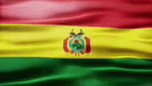 the flag of bolivia is waving in the wind .