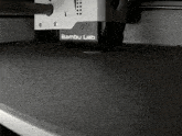 a black and white item with bambu lab written on it