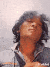 a close up of a man 's face with a shotcut ai video editor watermark on the bottom