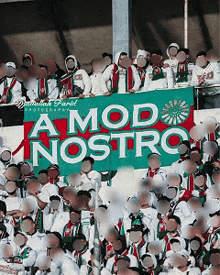 a group of people are standing in front of a banner that says a mod nostro