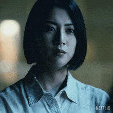 a close up of a woman 's face with netflix written on the bottom right