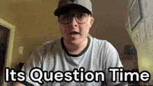 a man wearing glasses and a hat is saying " it 's question time "