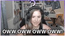 a woman wearing headphones says oww oww oww oww oww !