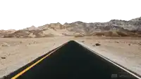 a road in the desert with mountains in the background is made with unscreen