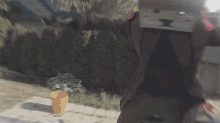 a blurry picture of a person wearing a mask with the letter t on it