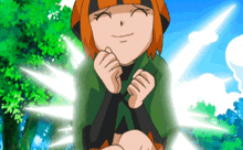 a cartoon girl with orange hair and a green shirt is smiling with her hands folded .