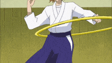 a man in a white shirt and blue pants is holding a yellow hula hoop