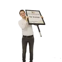a man holding a sign that says l van loonhoven
