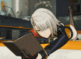 a girl laying on her stomach reading a book with a red ribbon around her neck that says ' cccp '