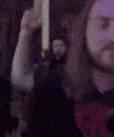 a blurry picture of a person 's face with a purple background .