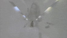 a person is standing in front of a tiled wall with smoke coming out of their head .